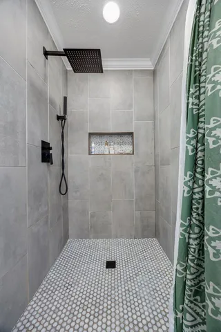 a view of a livingroom with workspace and a window