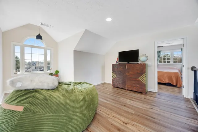 a bathroom with a toilet a sink and a mirror
