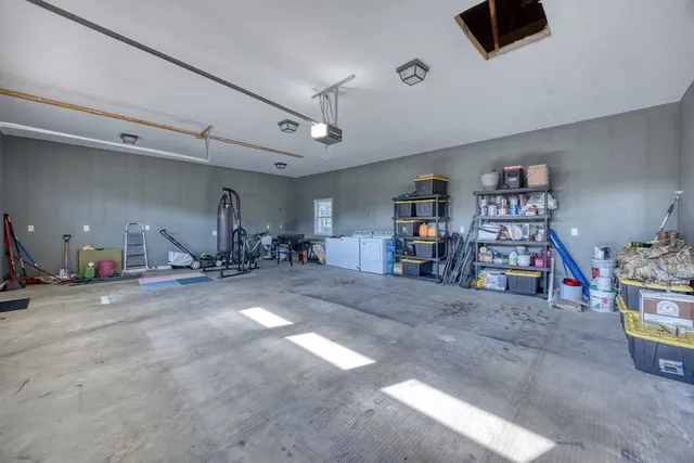 an aerial view of a house with a garden