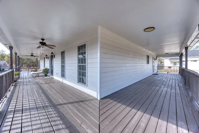 a living room with furniture fireplace and wooden floor