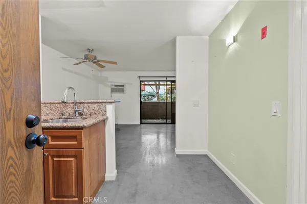 a view of a kitchen from the hallway