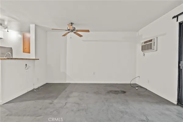 a view of a storage & utility room with closet