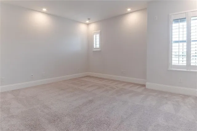 a bathroom with a shower a toilet and sink