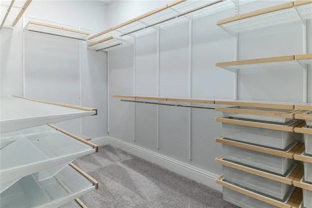 a view of swimming pool with a table and chairs