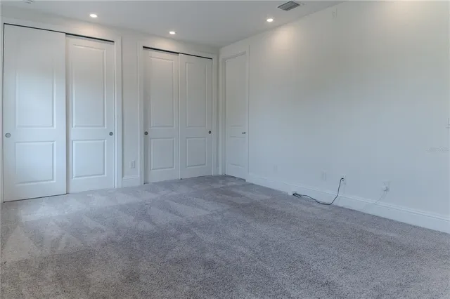 a kitchen with stainless steel appliances kitchen island granite countertop a stove a sink and a microwave