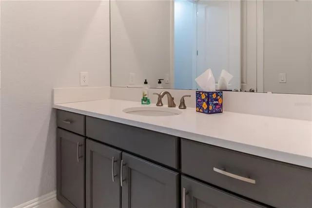 a large kitchen with stainless steel appliances granite countertop a sink and cabinets