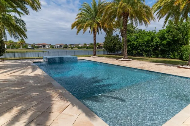 a view of a house with a palm tree