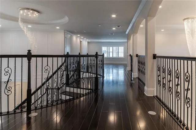 a view of a room with wooden floor and window