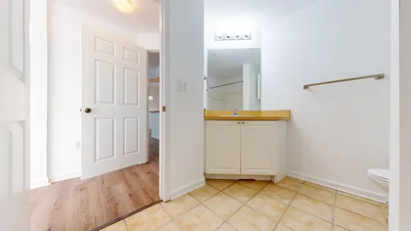 a bathroom with a bathtub toilet and shower