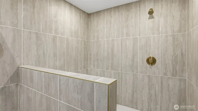 a bathroom with a shower and a tub