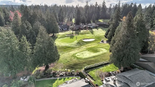 an aerial view of houses with yard
