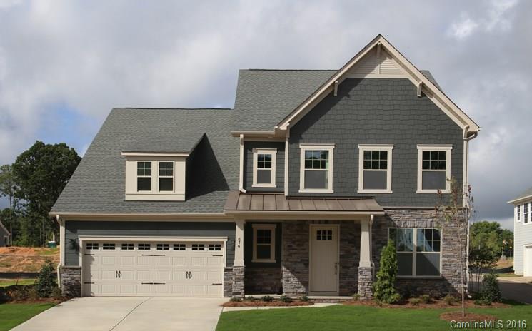 974 Emory Lane, Unit 111 Fort Mill, SC 29708 - Photo 1 of 22 a front view of a house with a yard and garage