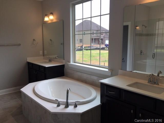 974 Emory Lane, Unit 111 Fort Mill, SC 29708 - Photo 11 of 22 a bathroom with a sink and a bathtub