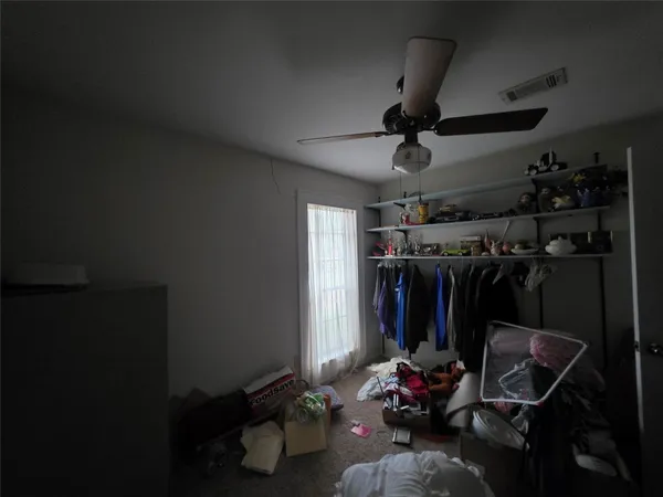 a room with furniture a flat screen tv and a window