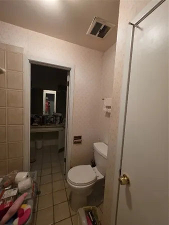 a bathroom with a shower and a toilet