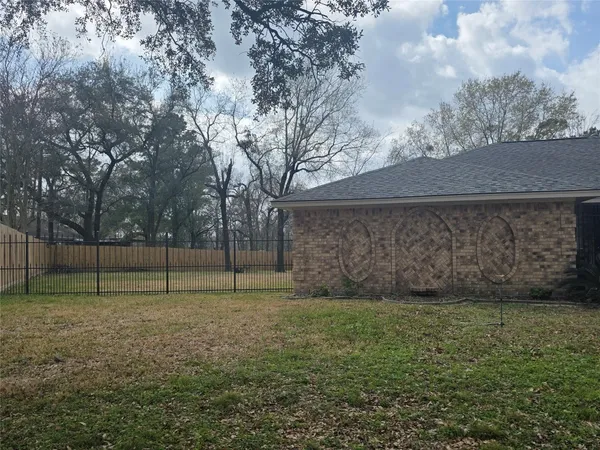a view of a backyard with a trampoline