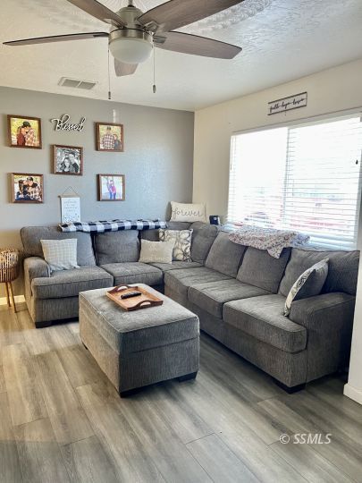 248 North Warner Street Ridgecrest, CA 93555 - Photo 4 of 21 a living room with furniture and a large window