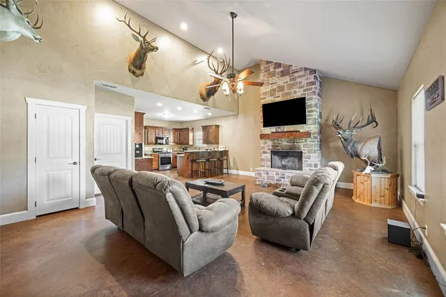 a living room with furniture fireplace and a flat screen tv