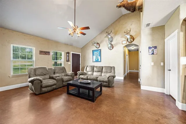 a living room with furniture and a large window