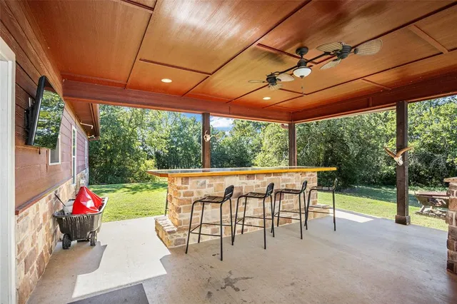 a view of yard with patio