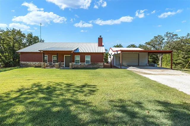 a view of a house with a big yard