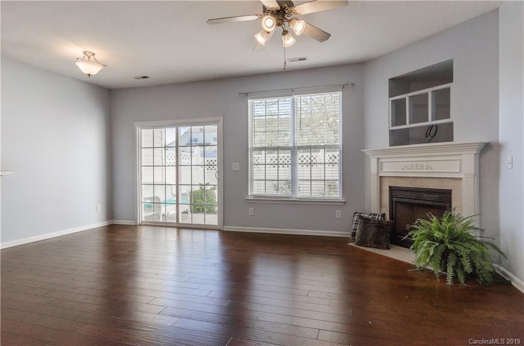 962 Copperstone Lane Fort Mill, SC 29708 - Photo 8 of 34 a view of an empty room with wooden floor and a window