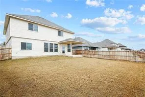 a front view of a house with a big yard