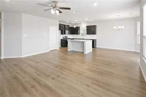 a view of a kitchen with a sink and a stove top oven