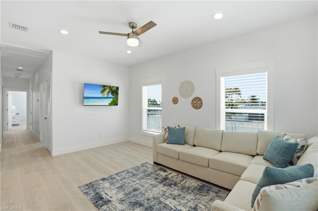 1 Fairview Boulevard Fort Myers Beach, FL 33931 - Photo 7 of 48 a living room with furniture and a large window