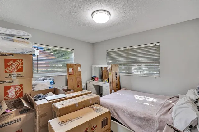 a bathroom with a sink and mirror with toilet