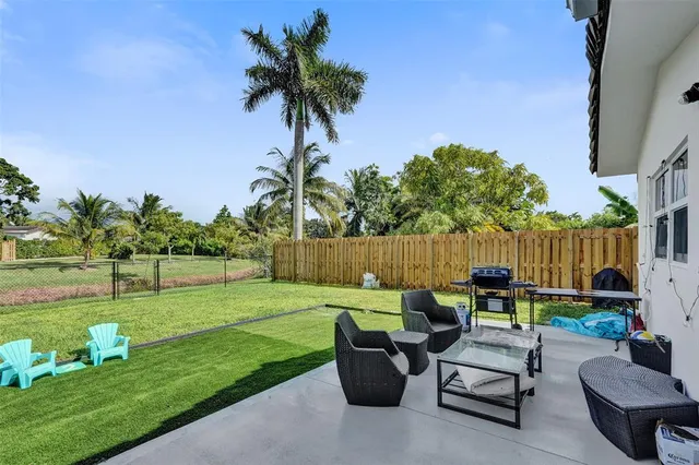 a backyard of a house with seating space