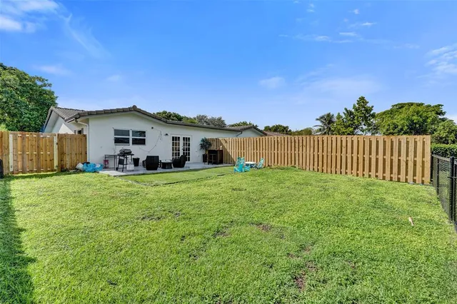 a front view of a house with sitting area
