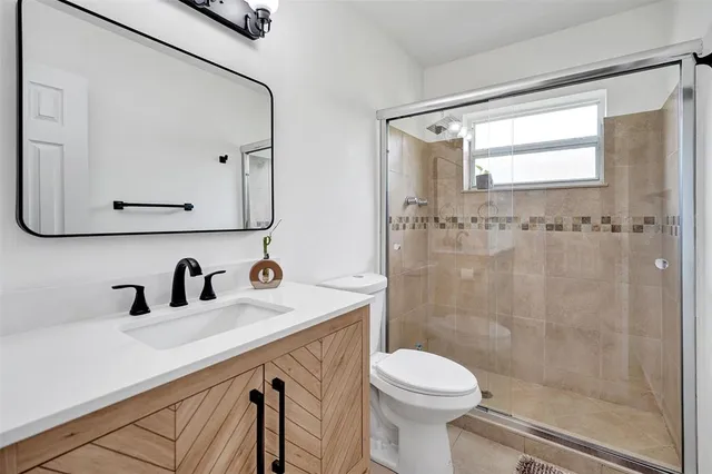 a view of a livingroom with wooden floor and a window