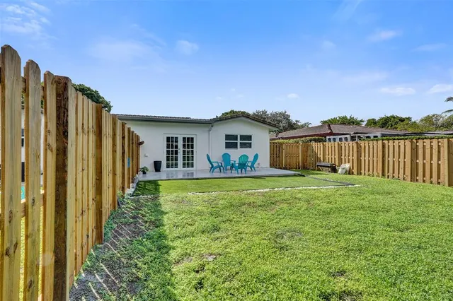 a backyard of a house with lots of green space