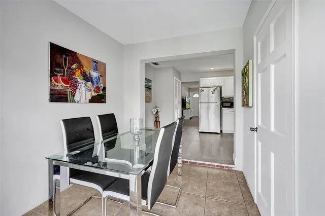 a view of a livingroom with furniture and a flat screen tv