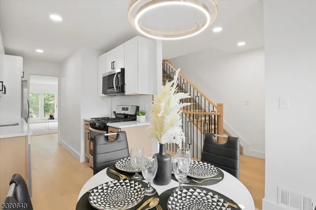 a living room with furniture a rug and a window