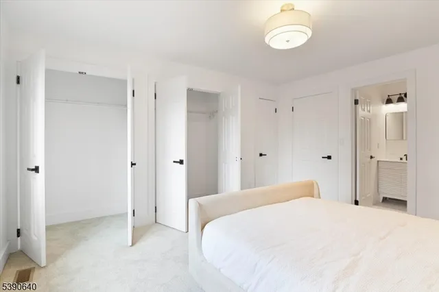 a bedroom with a bed and a mirror