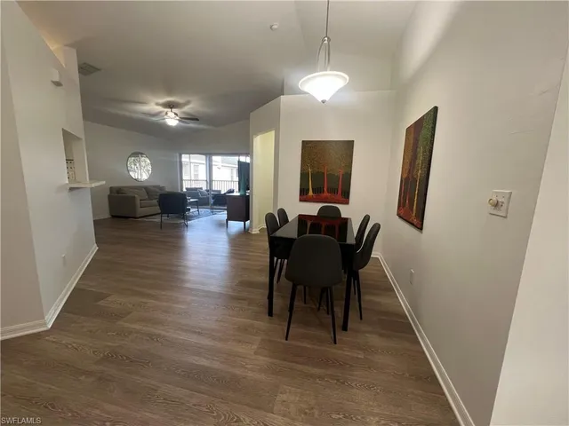 a view of a livingroom with furniture and a window