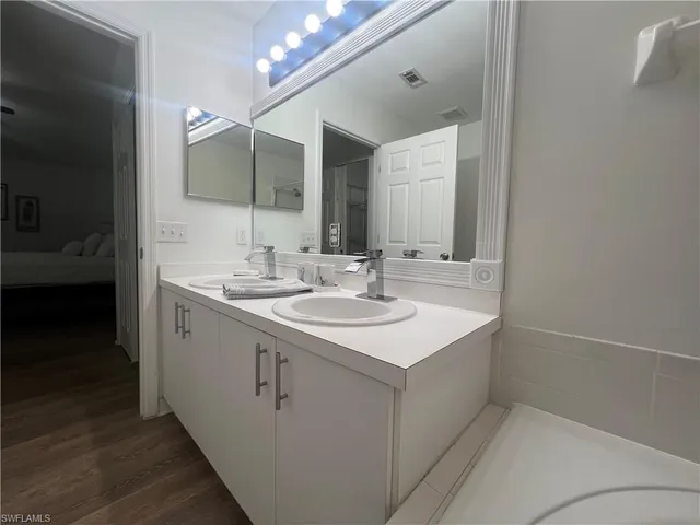 a bathroom with a sink and a mirror