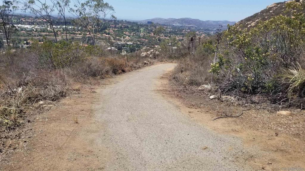 12526 Southwest Boulder Mt Road Poway, CA 92064 - Photo 16 of 16 a view of a dry field with trees in the background