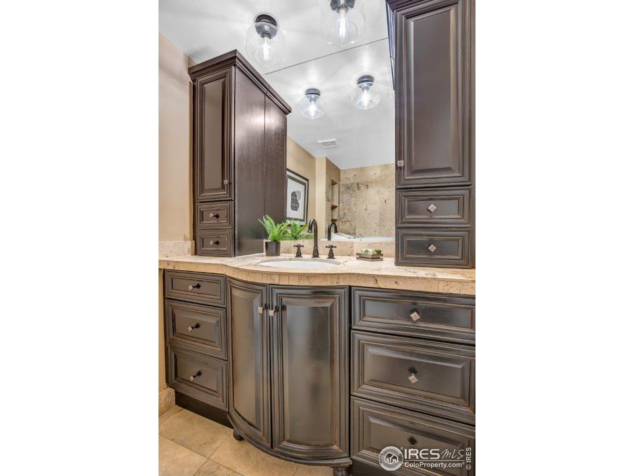 500 Mohawk Drive, Unit 103 Boulder, CO 80303 - Photo 15 of 28 a bathroom with a sink and a mirror