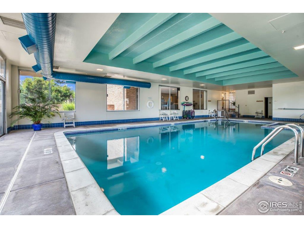 500 Mohawk Drive, Unit 103 Boulder, CO 80303 - Photo 24 of 28 a swimming pool with outdoor seating