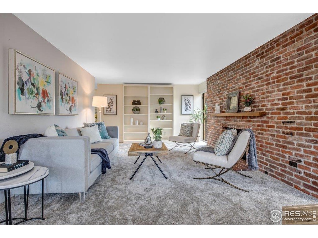 500 Mohawk Drive, Unit 103 Boulder, CO 80303 - Photo 3 of 28 a living room with furniture and a fireplace