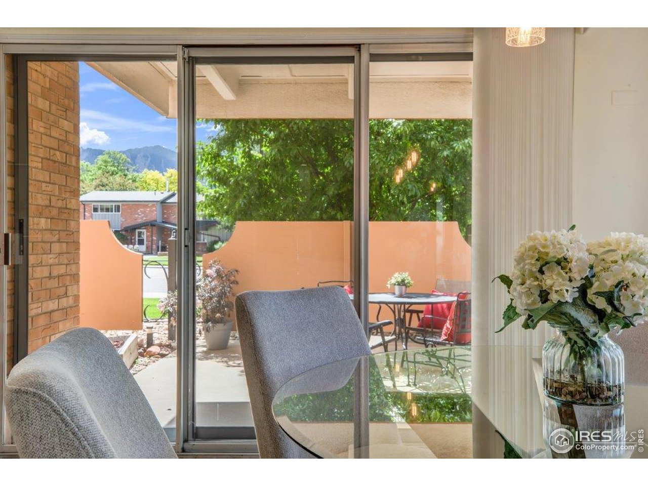 500 Mohawk Drive, Unit 103 Boulder, CO 80303 - Photo 6 of 28 a balcony with table and chairs