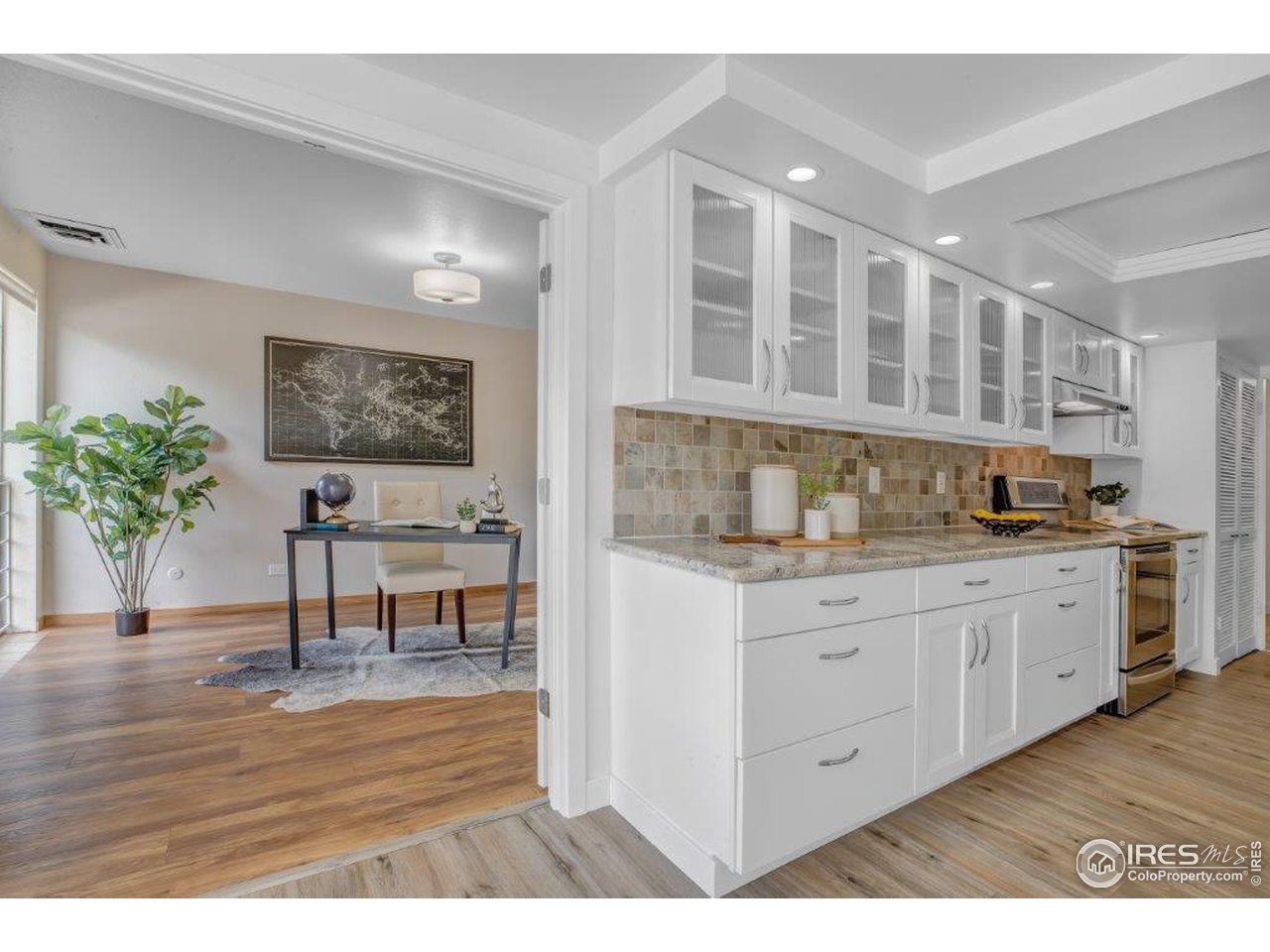 500 Mohawk Drive, Unit 103 Boulder, CO 80303 - Photo 8 of 28 a kitchen with granite countertop a stove a sink and a refrigerator