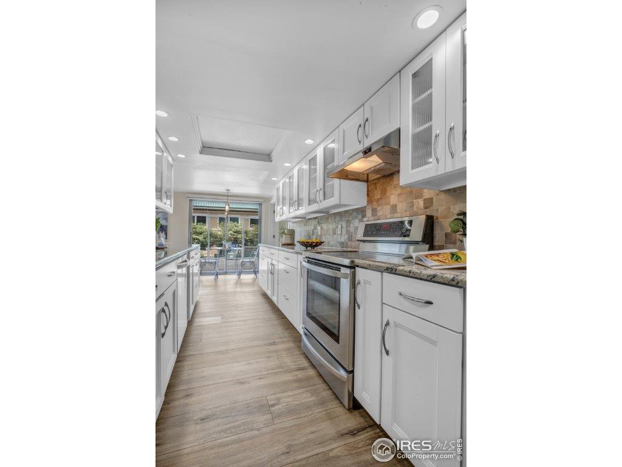 500 Mohawk Drive, Unit 103 Boulder, CO 80303 - Photo 9 of 28 a view of a kitchen from the hallway