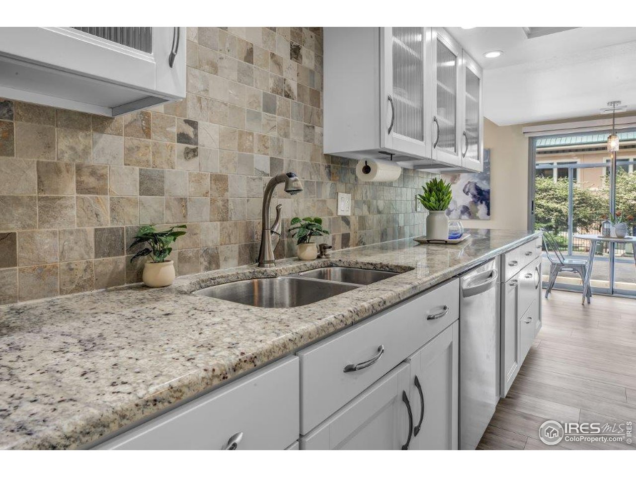 500 Mohawk Drive, Unit 103 Boulder, CO 80303 - Photo 10 of 28 a kitchen with stainless steel appliances granite countertop a sink and a counter top space