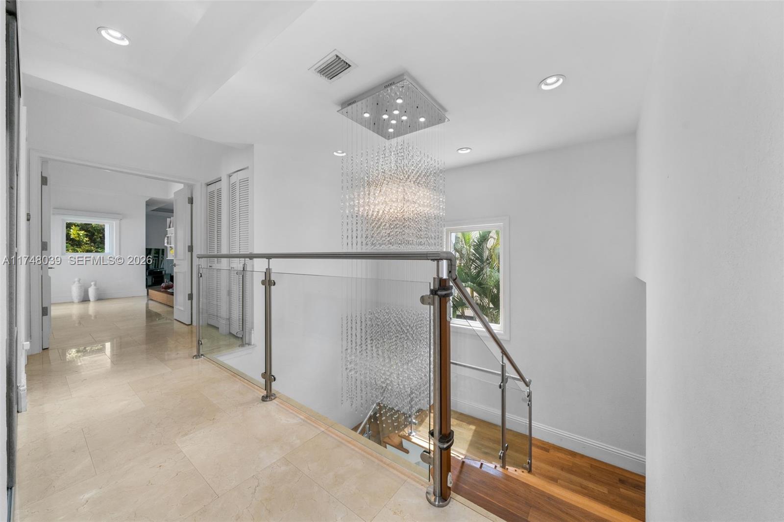 6 Coconut Lane Key Biscayne, FL 33149 - Photo 18 of 49 a view of a hallway with workspace and entryway