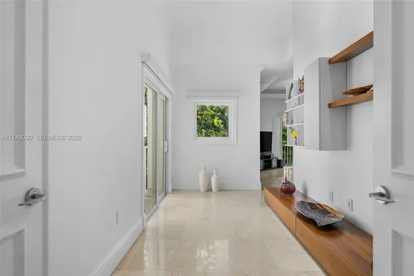 a room with gym equipment and a table