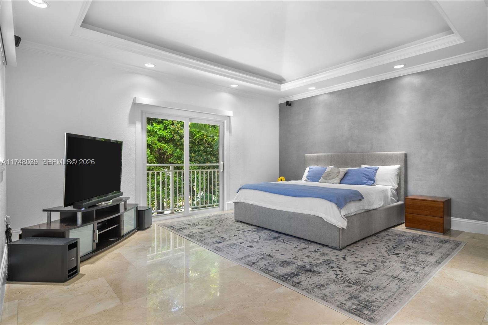 6 Coconut Lane Key Biscayne, FL 33149 - Photo 20 of 49 a spacious bedroom with a bed and a flat screen tv